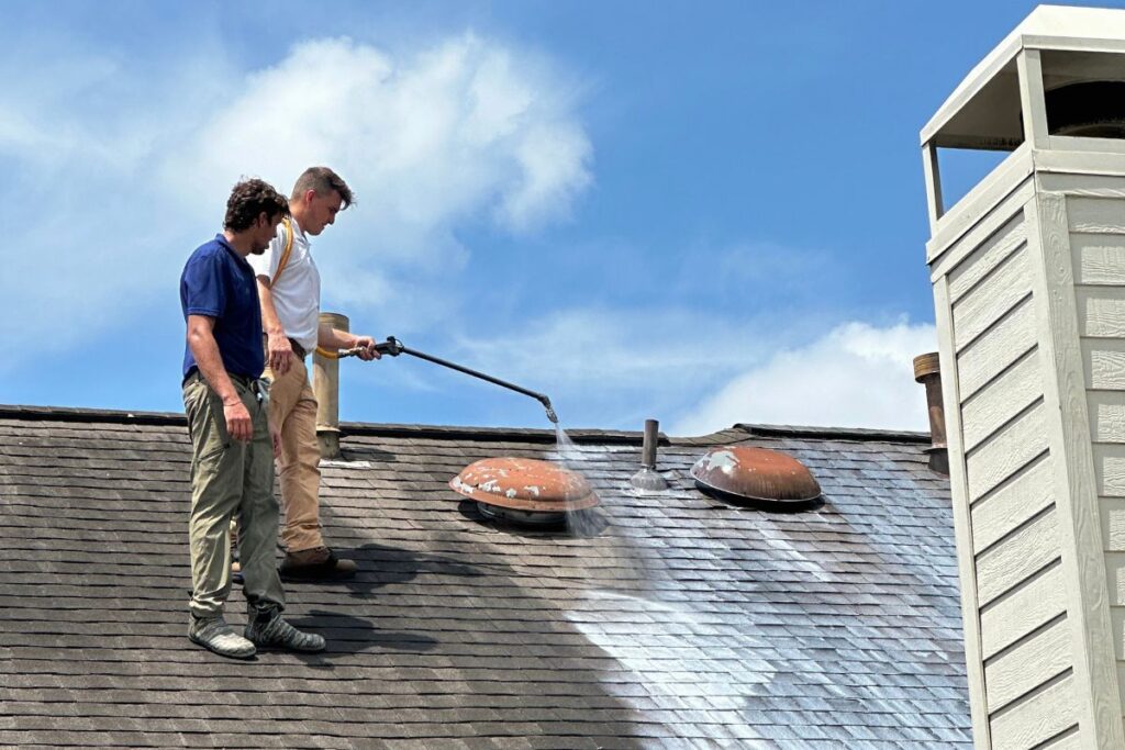 The team sprays a roof